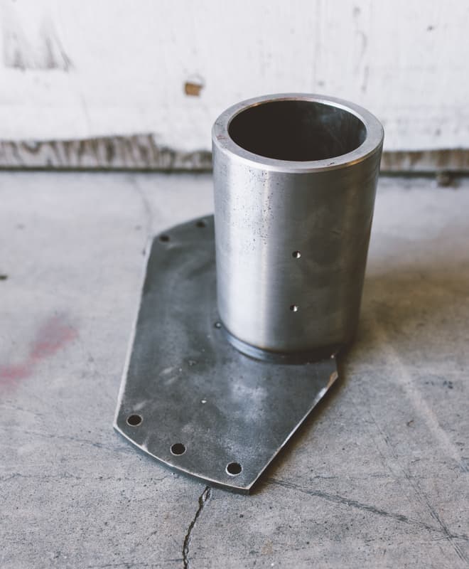 Robotic weld-cell assembly part staged after weld